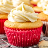 Yellow cupcakes in pink liners with white polka dots.