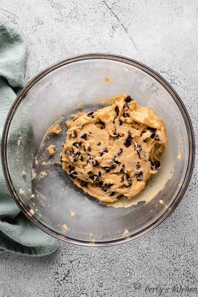 Chocolate chip cookie dough in a bowl.