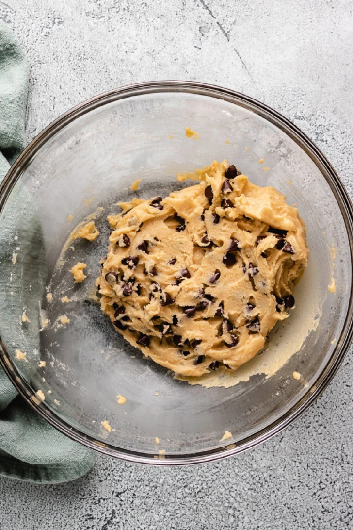 Chocolate chip cookie dough in a bowl.