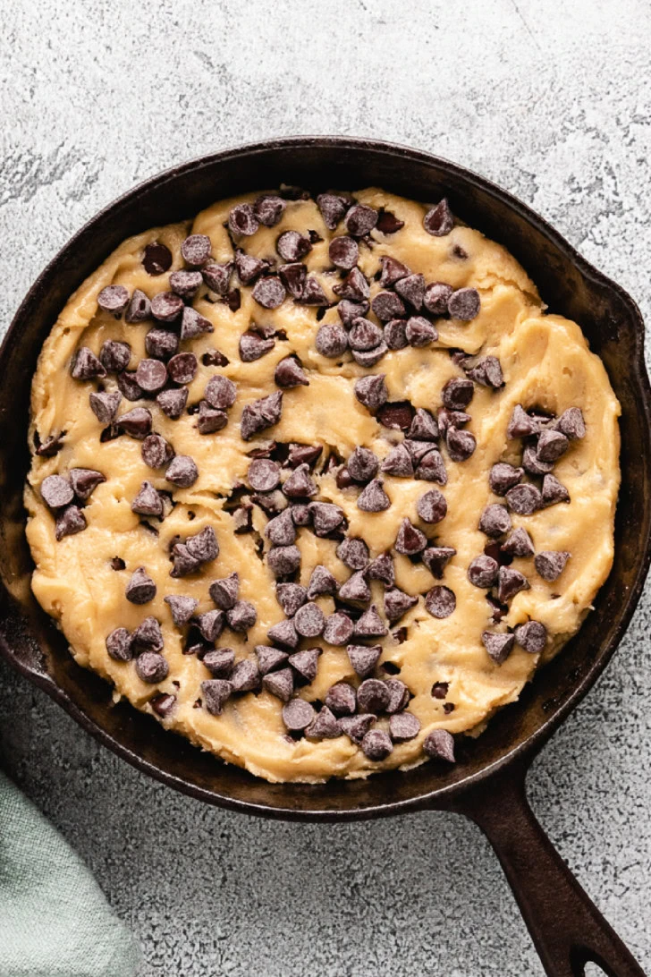 Cookie batter pressed in a skillet.