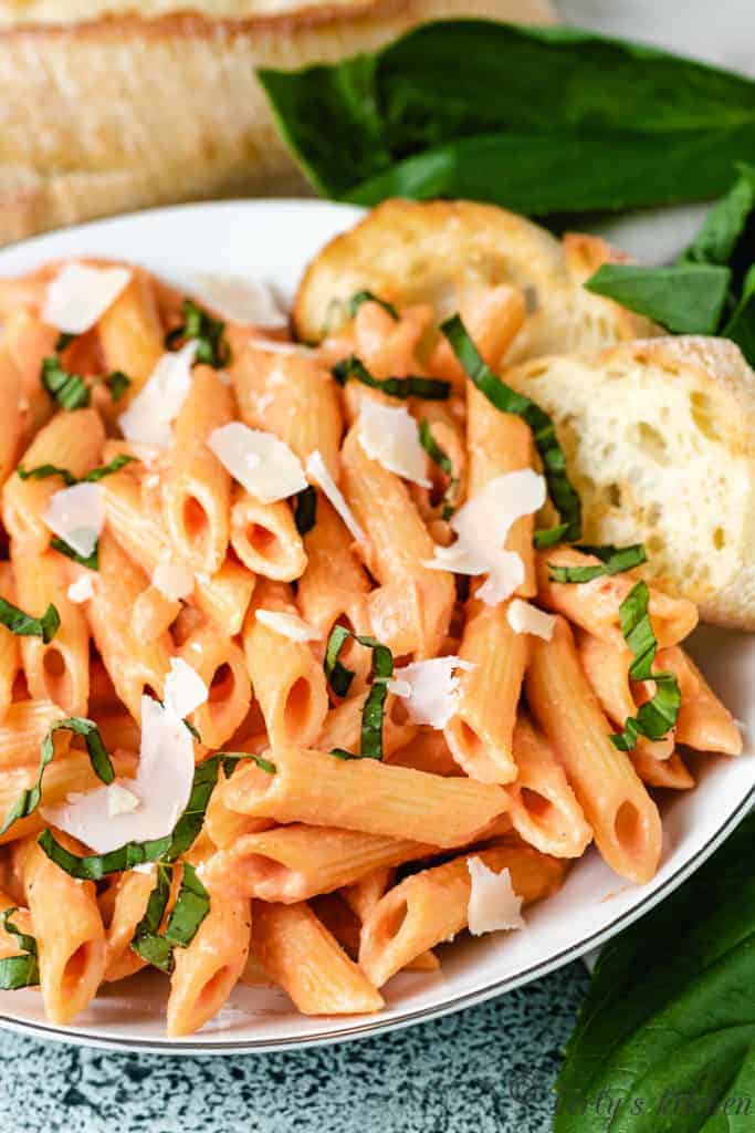 Penne noodles in pink sauce with fresh Parmesan.