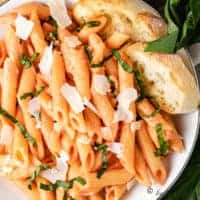 Pasta noodles, vodka sauce, basil, and parmesan cheese.