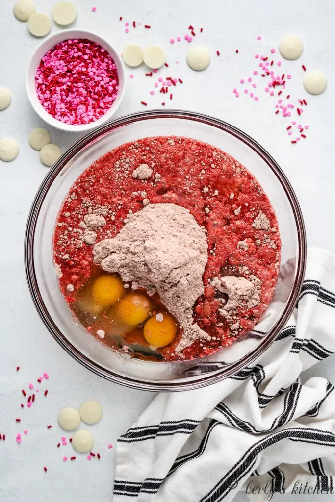 Red velvet cake batter ingredients in a bowl.