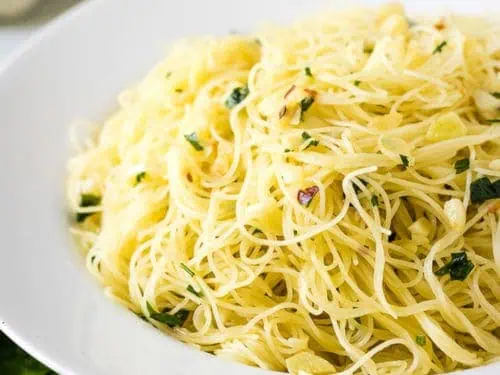 Angel hair pasta recipe with red pepper flakes and parsley.