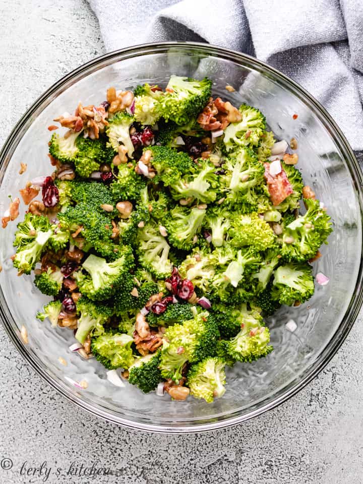Broccoli salad in a glass bowl.