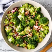Top down view of broccoli salad in a gray serving dish.