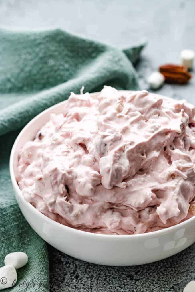 Cherry fluff salad in a white dish.