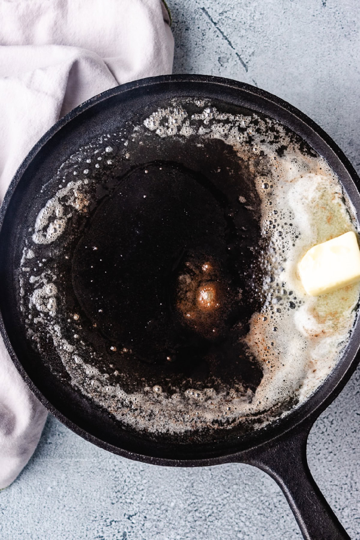 Butter melting on cast iron.