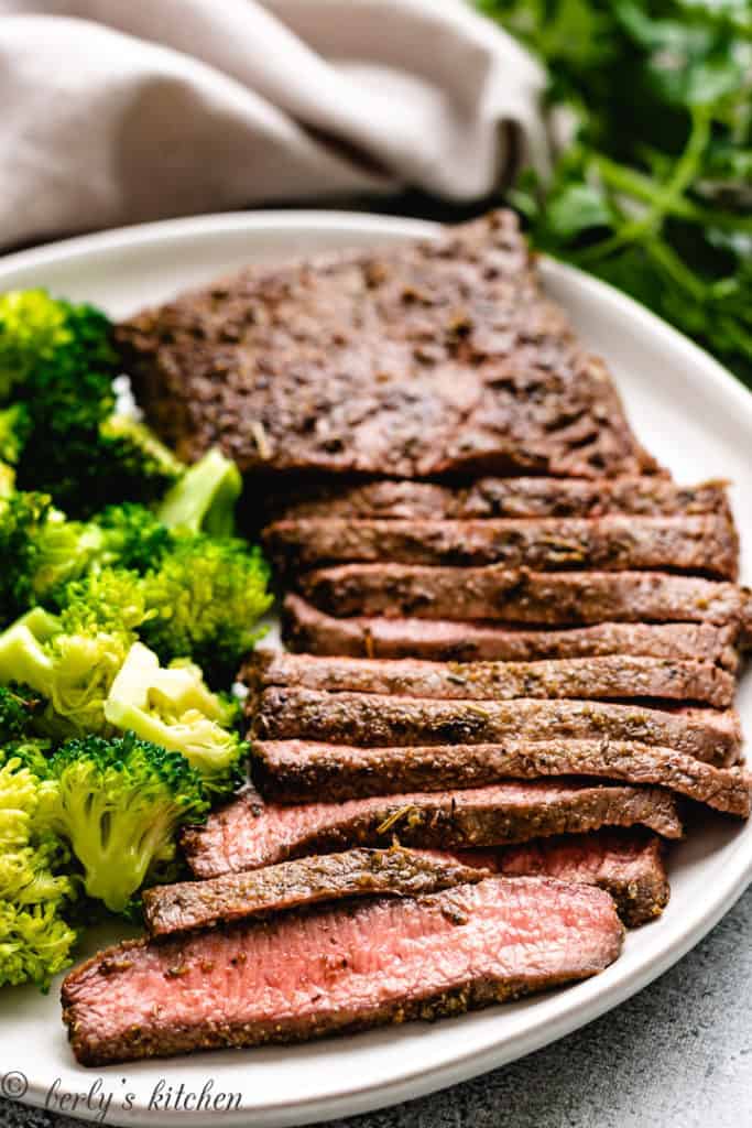 Sliced steak with fresh vegetables.