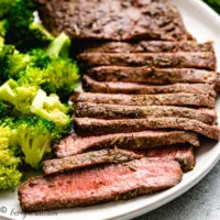 Flat iron steak and broccoli on a plate.