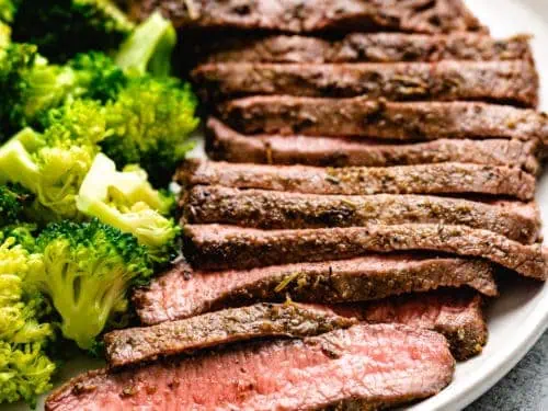 Flat iron steak and broccoli on a plate.