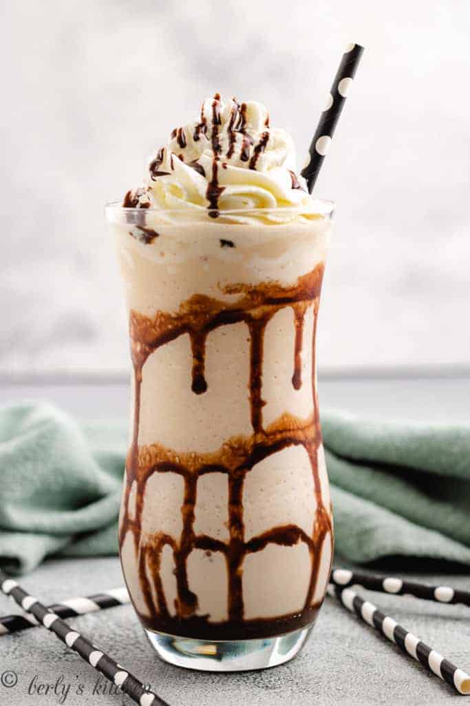 Frozen mudslide in a glass swirled with chocolate syrup.