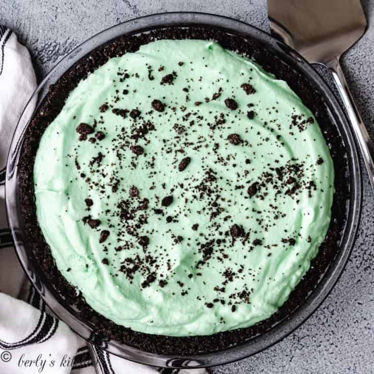 Top down view of mint pie covered in cookie crumbs.