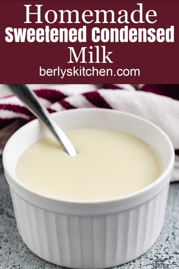 Sweetened condensed milk in ramekin with a spoon.
