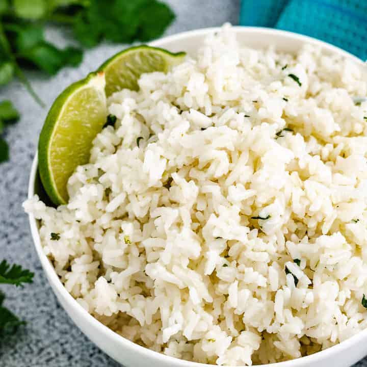 Easy Instant Pot Cilantro Lime Rice Close up view of cilantro lime rice in a bowl.