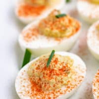 Close up view of cooked eggs sprinkled with spice.