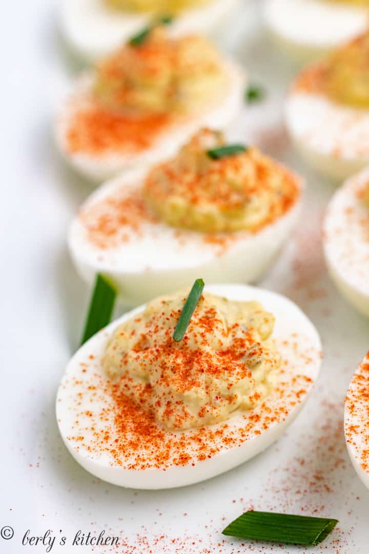 Close up view of cooked eggs sprinkled with spice.