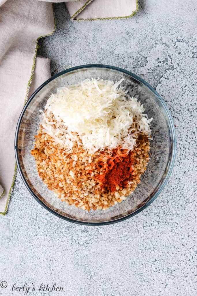 Breadcrumbs, parmesan cheese, and smoked paprika in a bowl.