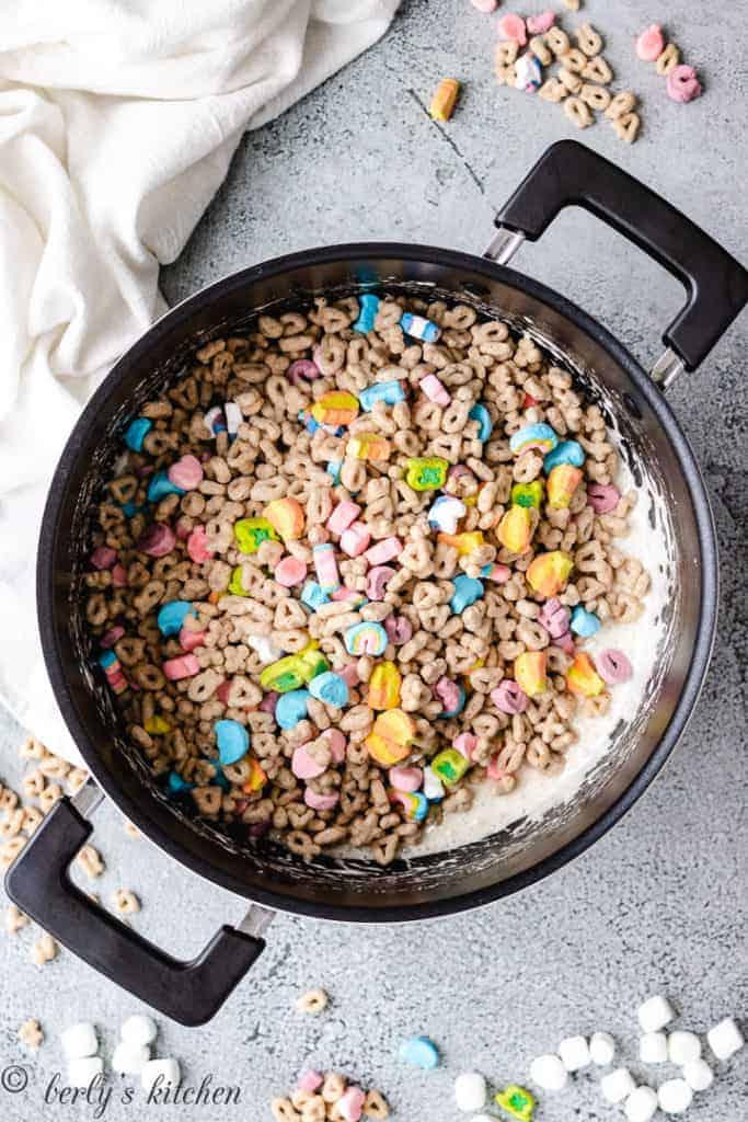 Cereal and melted marshmallows in a saucepan.