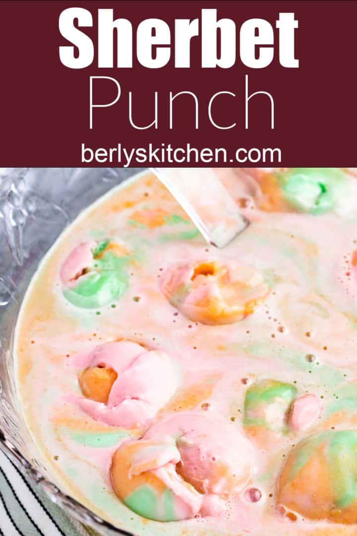 Top down view of rainbow sherbet punch in a large punch bowl.