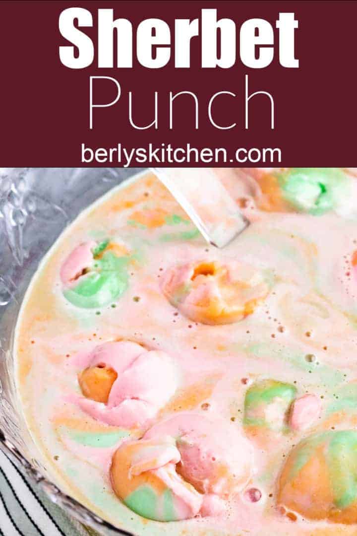 Top down view of rainbow sherbet punch in a large punch bowl.