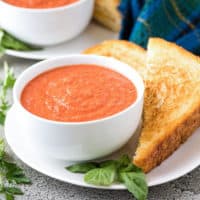 The tomato basil soup served with a grilled cheese sandwich.