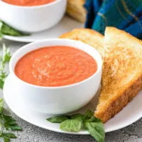 The tomato basil soup served with a grilled cheese sandwich.