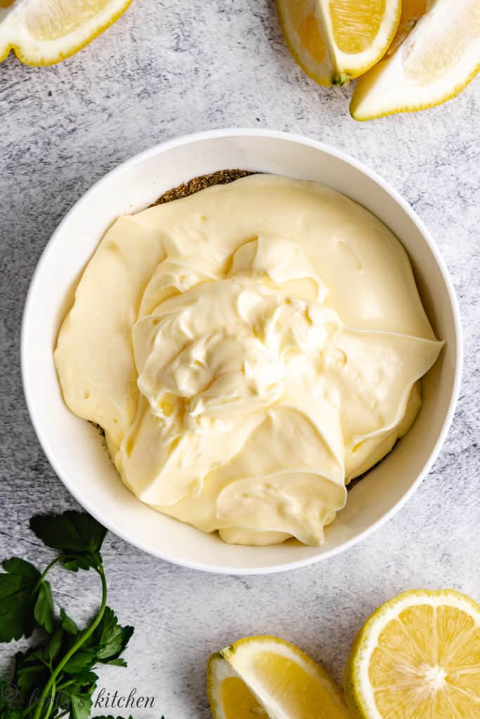Mayonnaise and seasonings in a bowl.