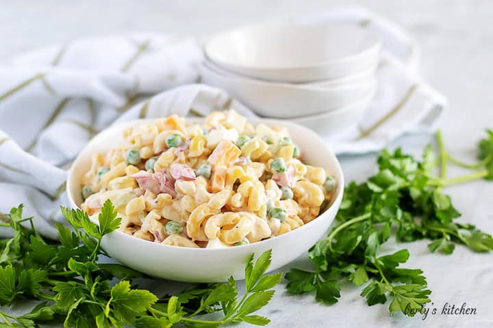 A big bowl of macaroni salad with a mayo based dressing.