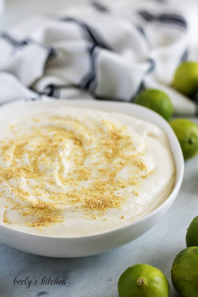Key lime cheesecake dip served in a white bowl.