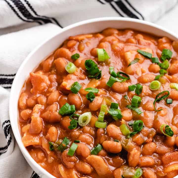 Slow Cooker Baked Beans Top down view of baked beans in a dish.