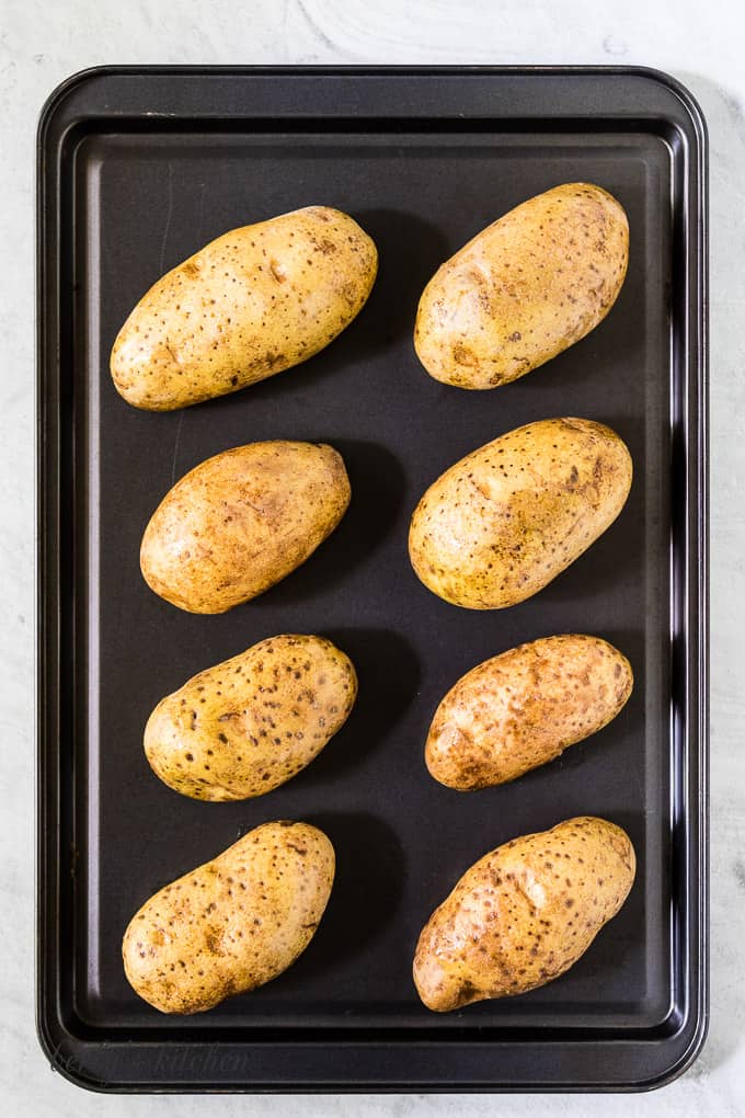 Baking potatoes on a baking sheet.