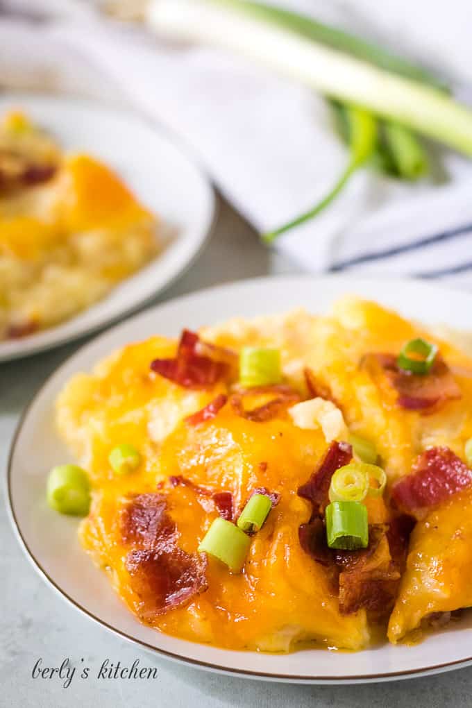 Twice baked potato casserole served with diced green onions.