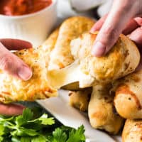 Cheesy breadstick with marinara dipping sauce.