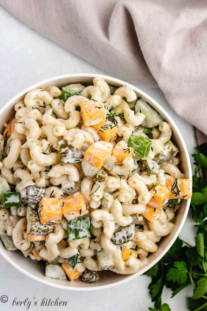 Top down view of dill pickle salad with cheese.