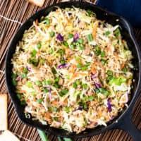 Top down view of egg roll in a bowl in cast iron.