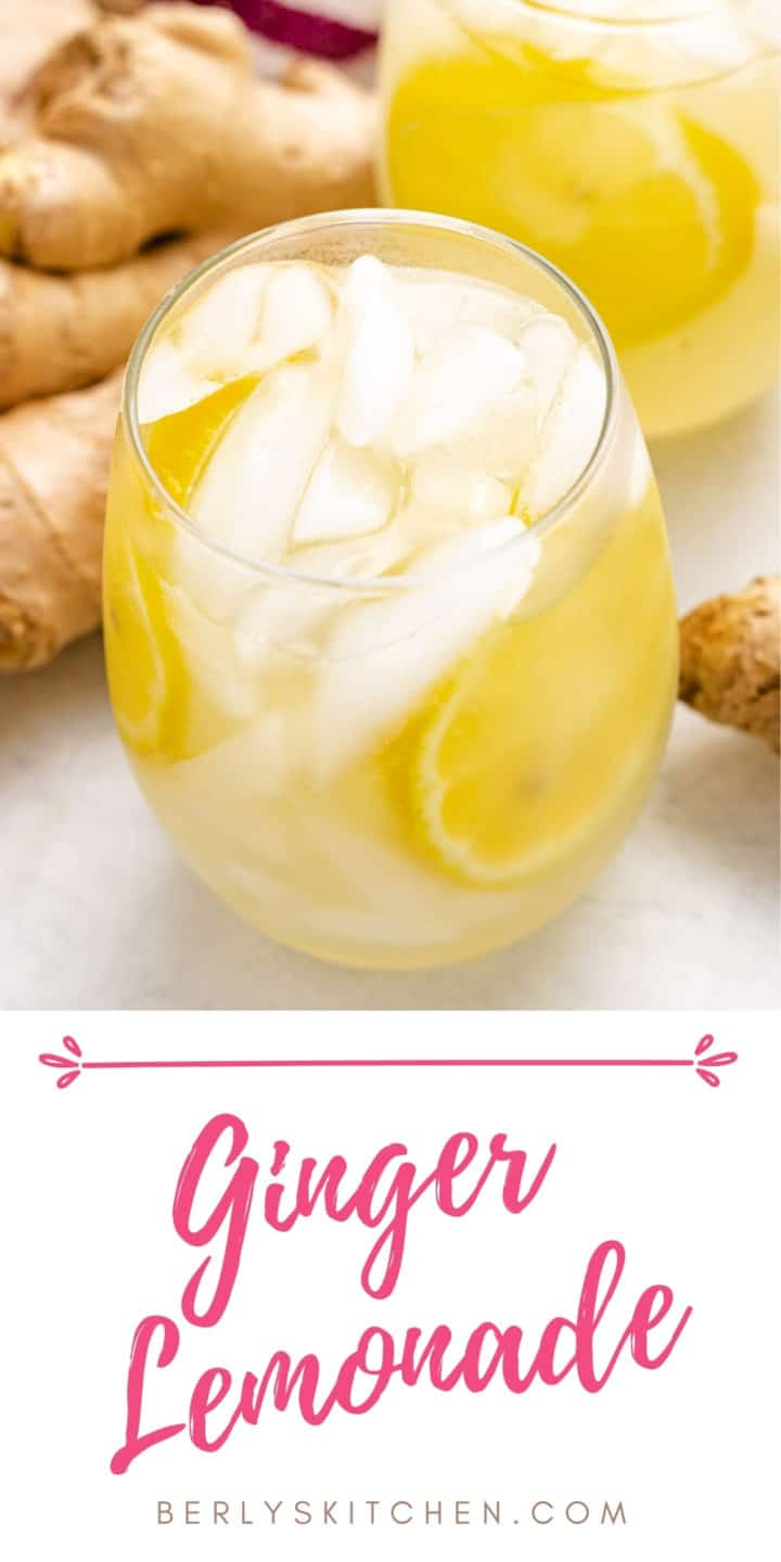 Ginger lemonade in a glass next to fresh ginger.