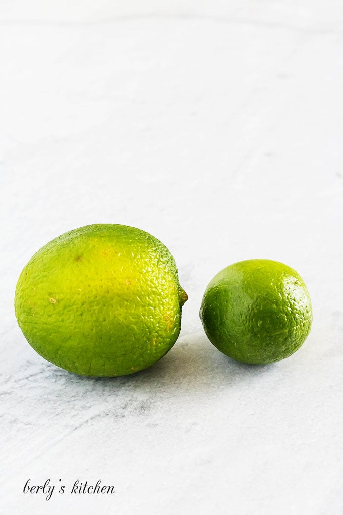 Photograph showing the difference between limes and key limes.