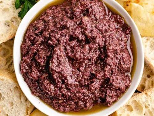 Top down view of olive spread in a small bowl.