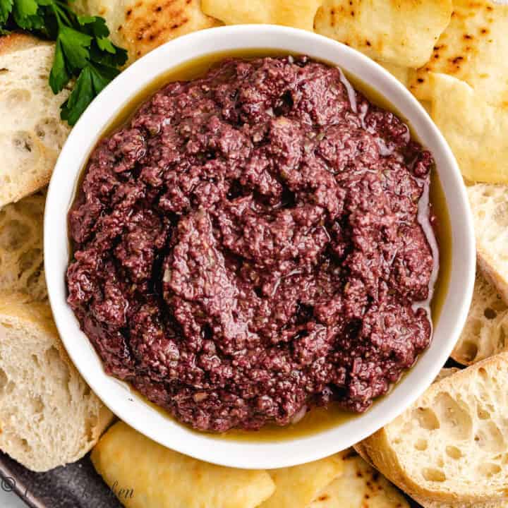 Top down view of olive spread in a small bowl.