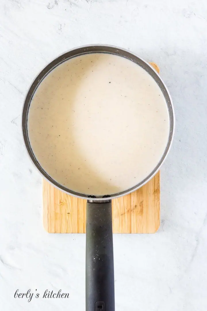 Top down view of bechamel sauce in a pan.
