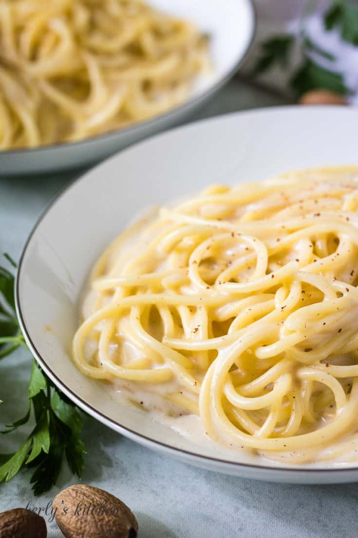 Noodles tossed with simple bechamel sauce in a dish.