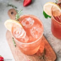 Top down view strawberry tequila cocktail with lemon slice.