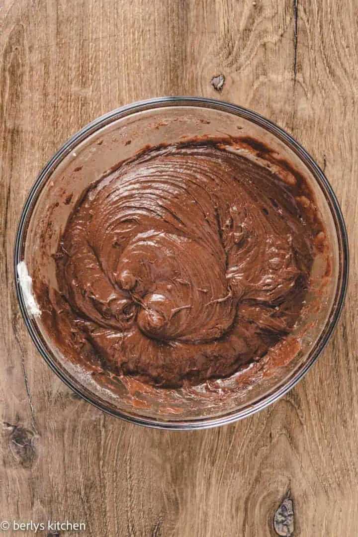 Top down view of chocolate cake batter in a bowl.