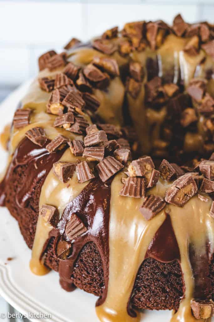 Top down view of chocolate bundt cake covered with chocolate and peanut butter.