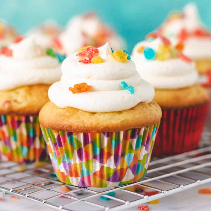 Fruity Pebbles Cupcakes Several cupcakes topped with colorful cereal.