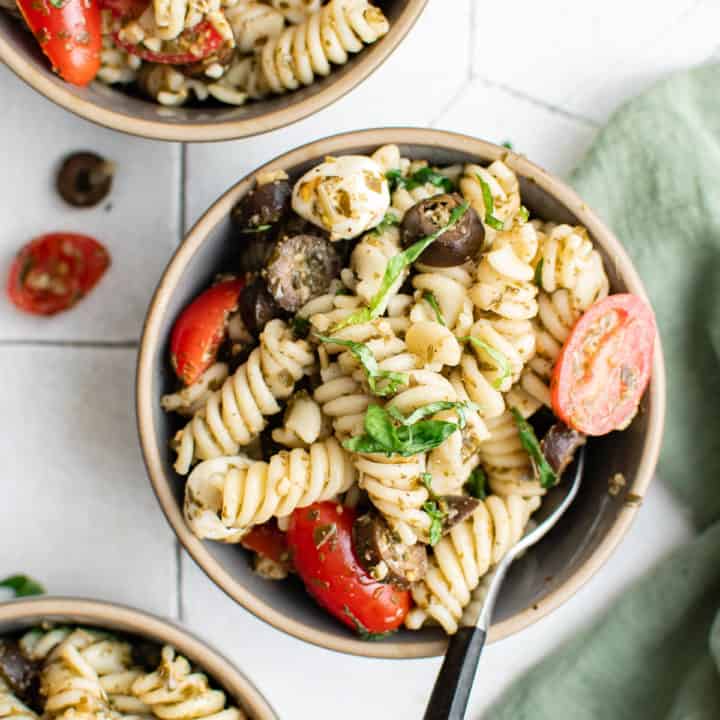 Pesto Pasta Salad Top down view of pesto pasta salad in bowls.