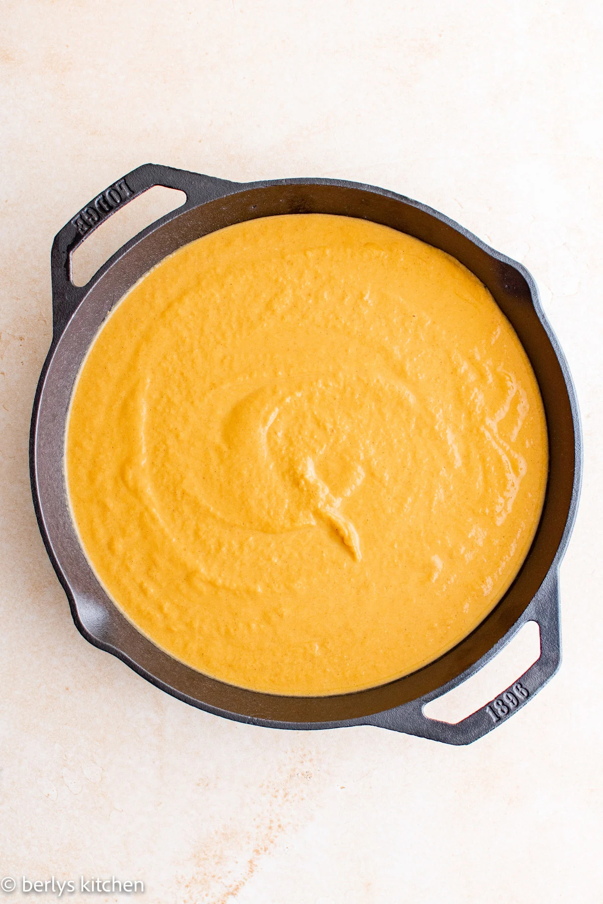 Top down view of pumpkin crisp filling in a pan.