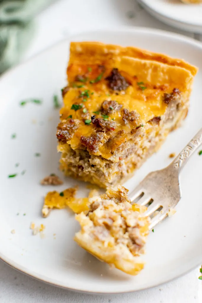 Piece of quiche on a fork.