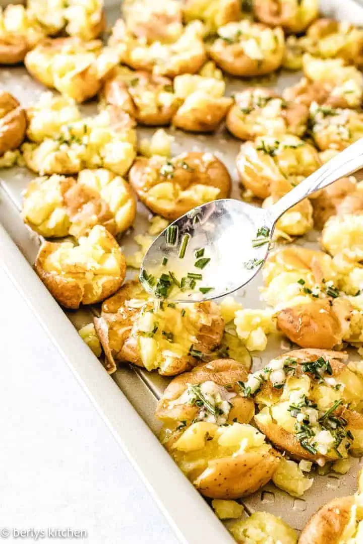 Smashed potatoes on a pan.